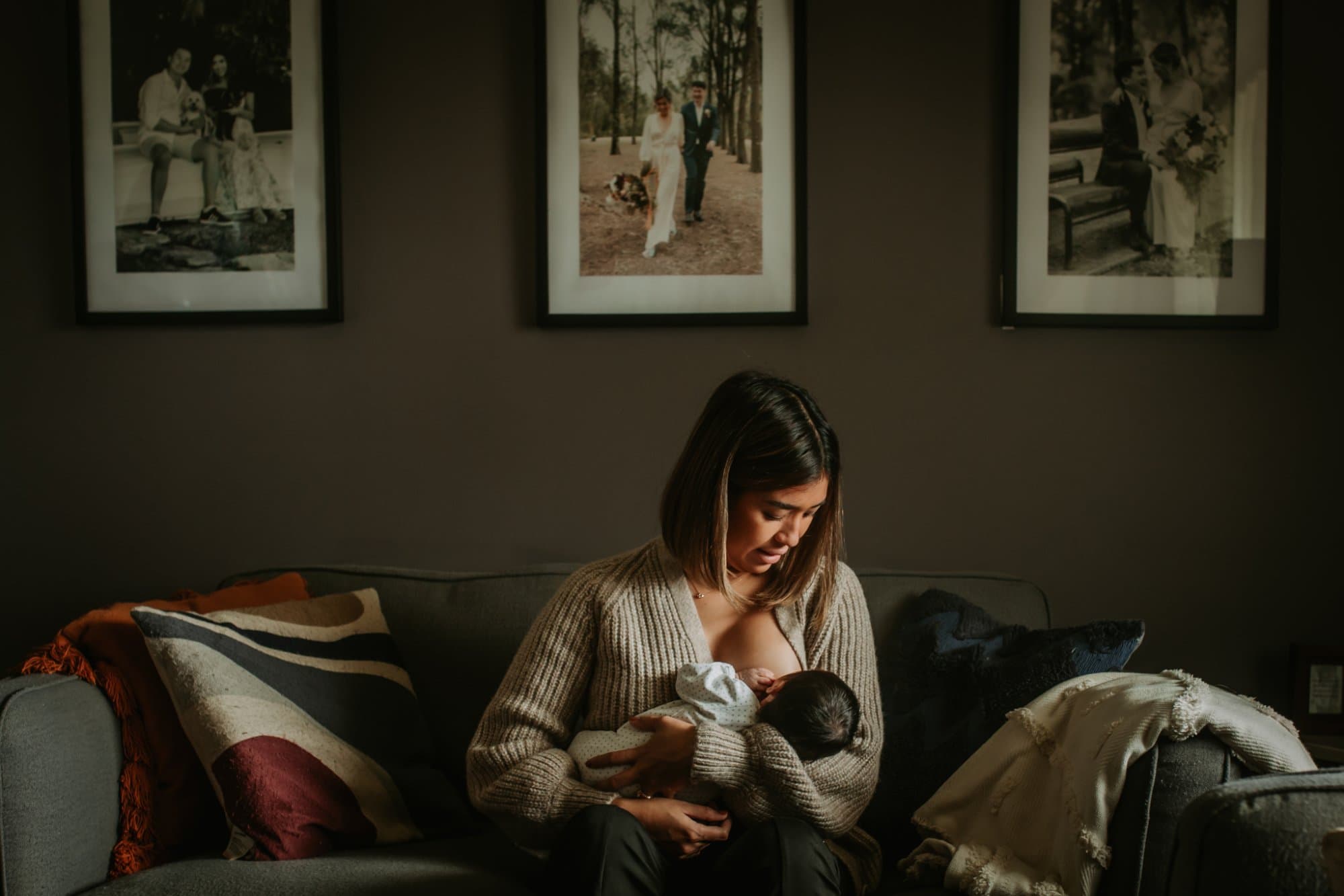 Angela breastfeeding newborn at home